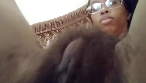 Ebony woman with a hairy pussy enjoying a solo session