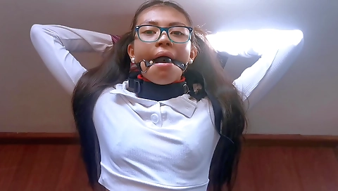 Young ebony girl with a sexy lingerie is playing with a toy