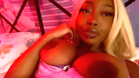 Ebony girl with a huge pair of tits gives a solo video