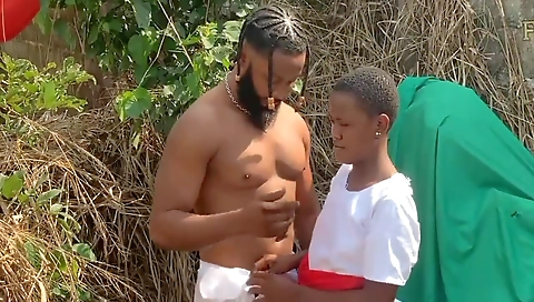 Ebony teen is getting fucked in the bush by a stud